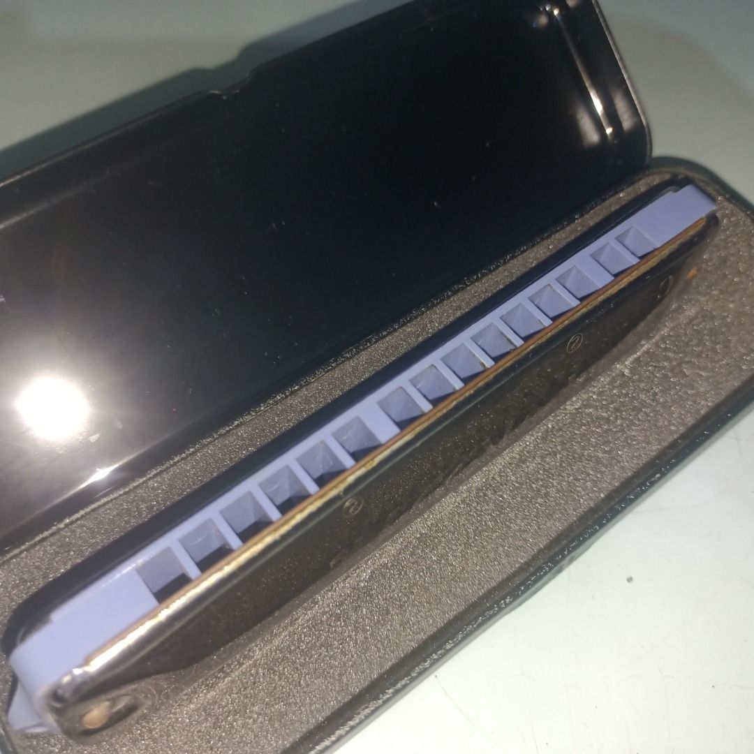 Yamaha No.155 Harmonica in Hard Case (Category: Musical Instruments) located in Munoz. Submitted by larryc1212 (Listing ID 1467680577, Image 2). Description: - Model: Yamaha No.155 Harmonica - Includes original black protective case with custom fitted foam interior - Features chrome-plated cover plates with engraved Yamaha logo and a blue plastic comb - Condition: Minor scuffs on the metal casing from previous handling, fully functional and ready