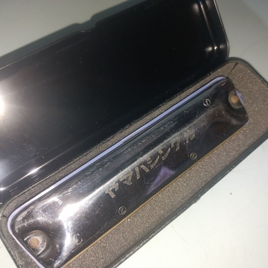 Yamaha No.155 Harmonica in Hard Case (Category: Musical Instruments) located in Munoz. Submitted by larryc1212 (Listing ID 1467680577, Image 1). Description: - Model: Yamaha No.155 Harmonica - Includes original black protective case with custom fitted foam interior - Features chrome-plated cover plates with engraved Yamaha logo and a blue plastic comb - Condition: Minor scuffs on the metal casing from previous handling, fully functional and ready