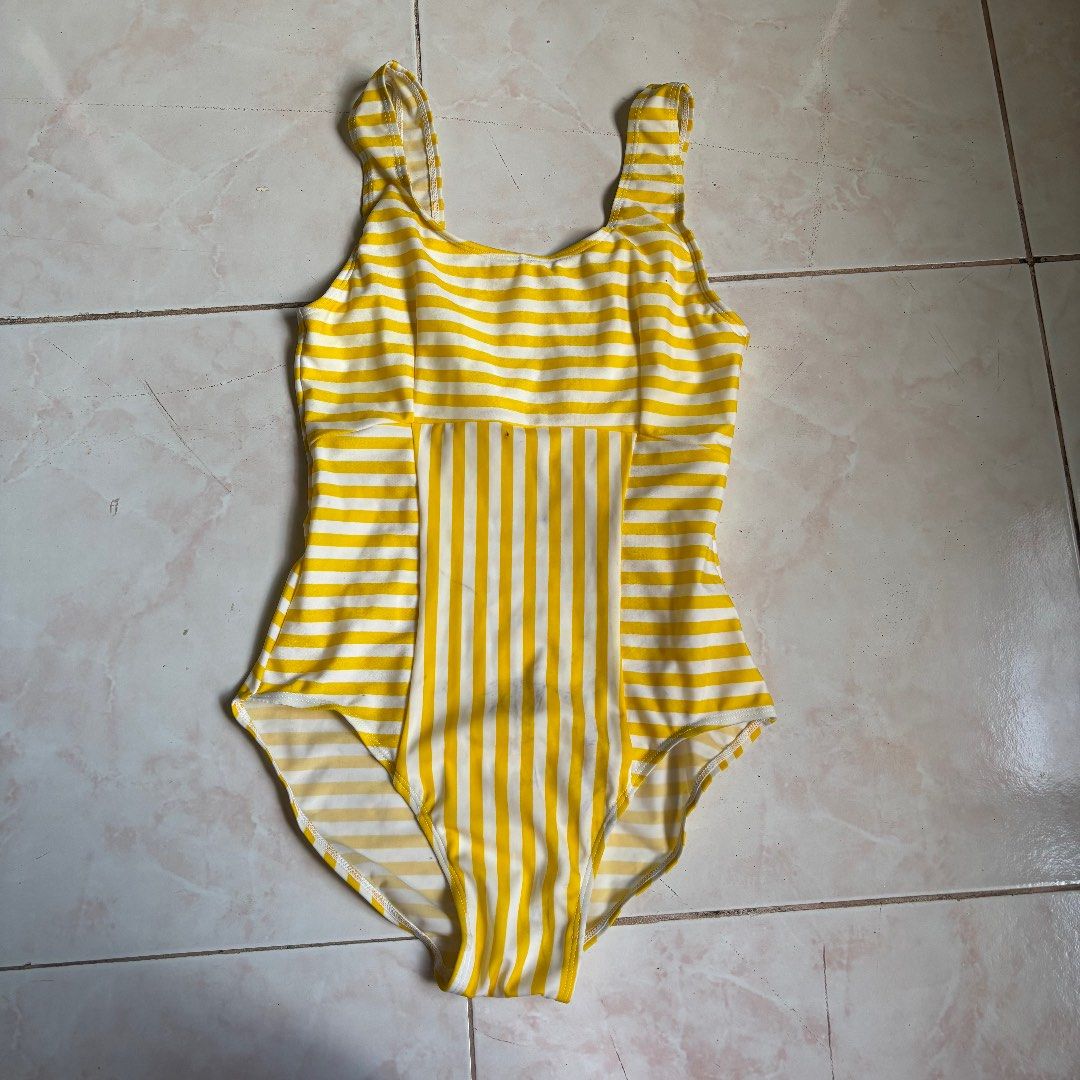 Yellow and White Striped One Piece Swimsuit (Category: Bikinis & Swimsuits) located in Agoncillo. Submitted by alcazarmfatima (Listing ID 1467728443, Image 1). Description: - Color: Yellow and white stripes - Design: Scoop neck with straps, unique vertical and horizontal stripe pattern - Fabric: Stretchy, comfortable material - Ideal for: Swimming, pool parties, and beach days - has some discoloration.