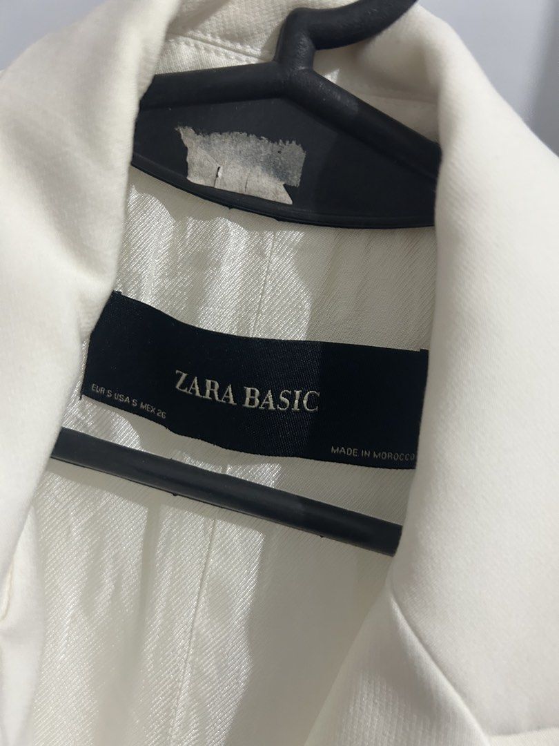 Zara Basic White Sleeveless Blazer Vest (Category: Sleeveless) located in Sorsogon. Submitted by jonacel (Listing ID 1467722382, Image 2). Description: - Brand: Zara Basic - Size: S - Color: White - Style: Sleeveless blazer vest with lapel collar and open front - Details: Two front welt pockets, fully lined, lightweight material - Condition: Clean and ready to wear - Versatile: Great for workwear or casual layering.