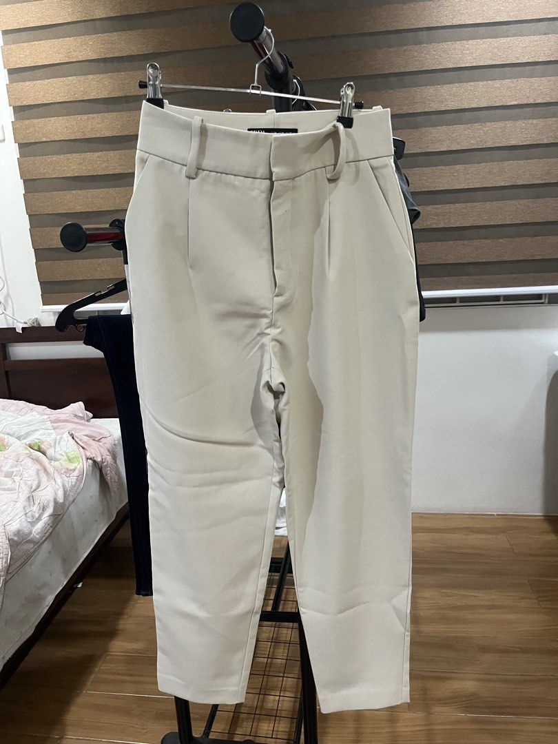 Zara Beige Tailored Trousers Size M (Category: Trousers) located in Makati City. Submitted by grizzlybear95 (Listing ID 1467730119, Image 1). Description: - Brand: Zara - Size: M / MEX 28 - Color: Cream / Beige - Details: Front pleats, belt loops, functional side pockets, clean back design with welt pocket details - Fabric: Smooth finish with slight stretch - Style: Versatile neutral trousers, great for work or casual outings.