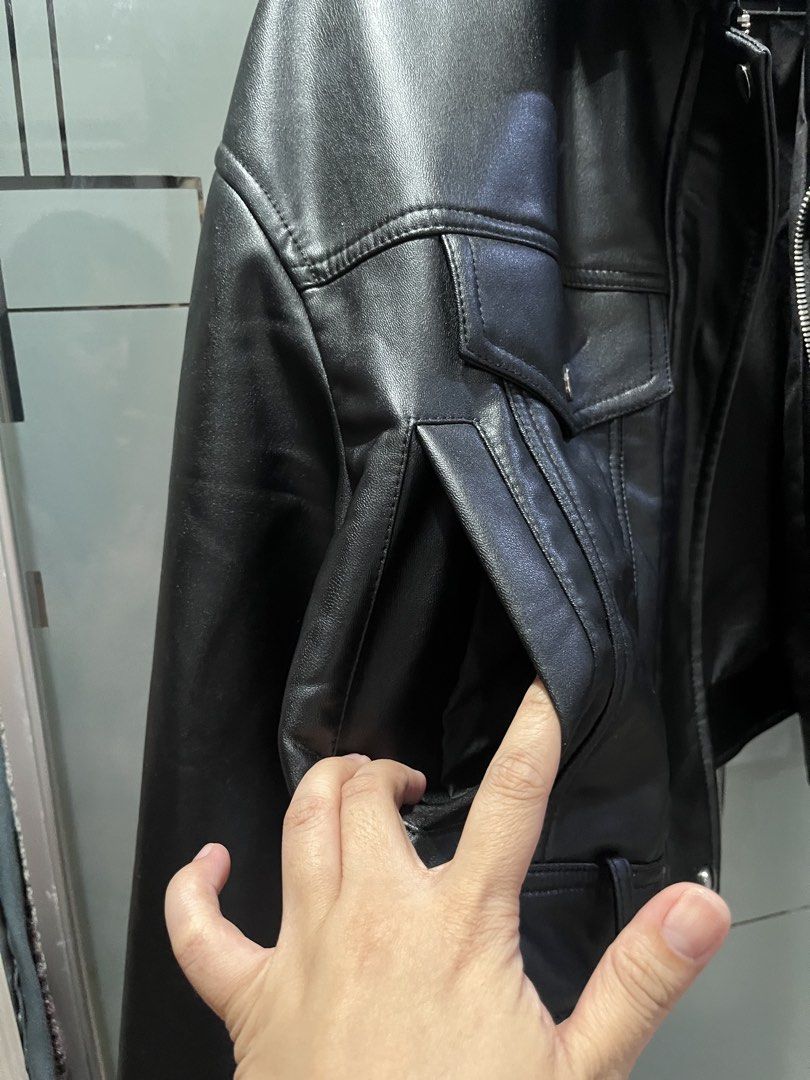 Zara Black Faux Leather Jacket (Category: Coats, Jackets and Outerwear) located in Makati City. Submitted by grizzlybear95 (Listing ID 1467733817, Image 2). Description: - Brand/Style: Zara black faux leather jacket - Fit: Cropped fit with collar - Closure: Front zipper and snap buttons - Pockets: Flap chest pockets and side pockets - Details: Zippers on the sleeves - Condition: Clean, worn a couple of times - Perfect for layering - Minimal chipp