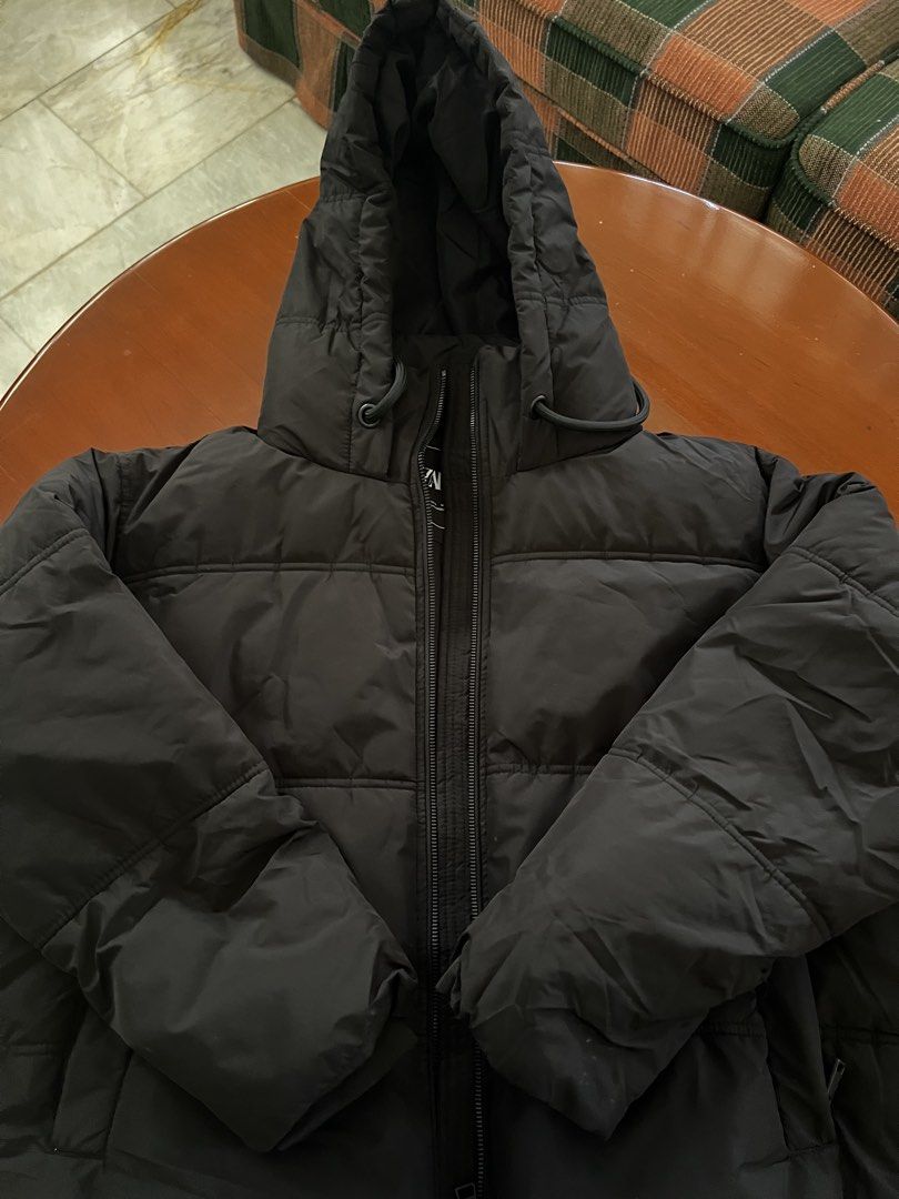 Zara Black Puffer Jacket with Hood (Category: Coats, Jackets and Outerwear) located in Cainta. Submitted by preloved_sale8 (Listing ID 1467629942, Image 1). Description: - Brand: Zara - Style: Puffer jacket in classic black - Size: L (best fit medium to large) - used once in Japan - in good condition (hnd namumuo) - Features: Full zip front, adjustable drawstring hood, quilted design, and two front pockets - Condition: Excellent, warm winter laye