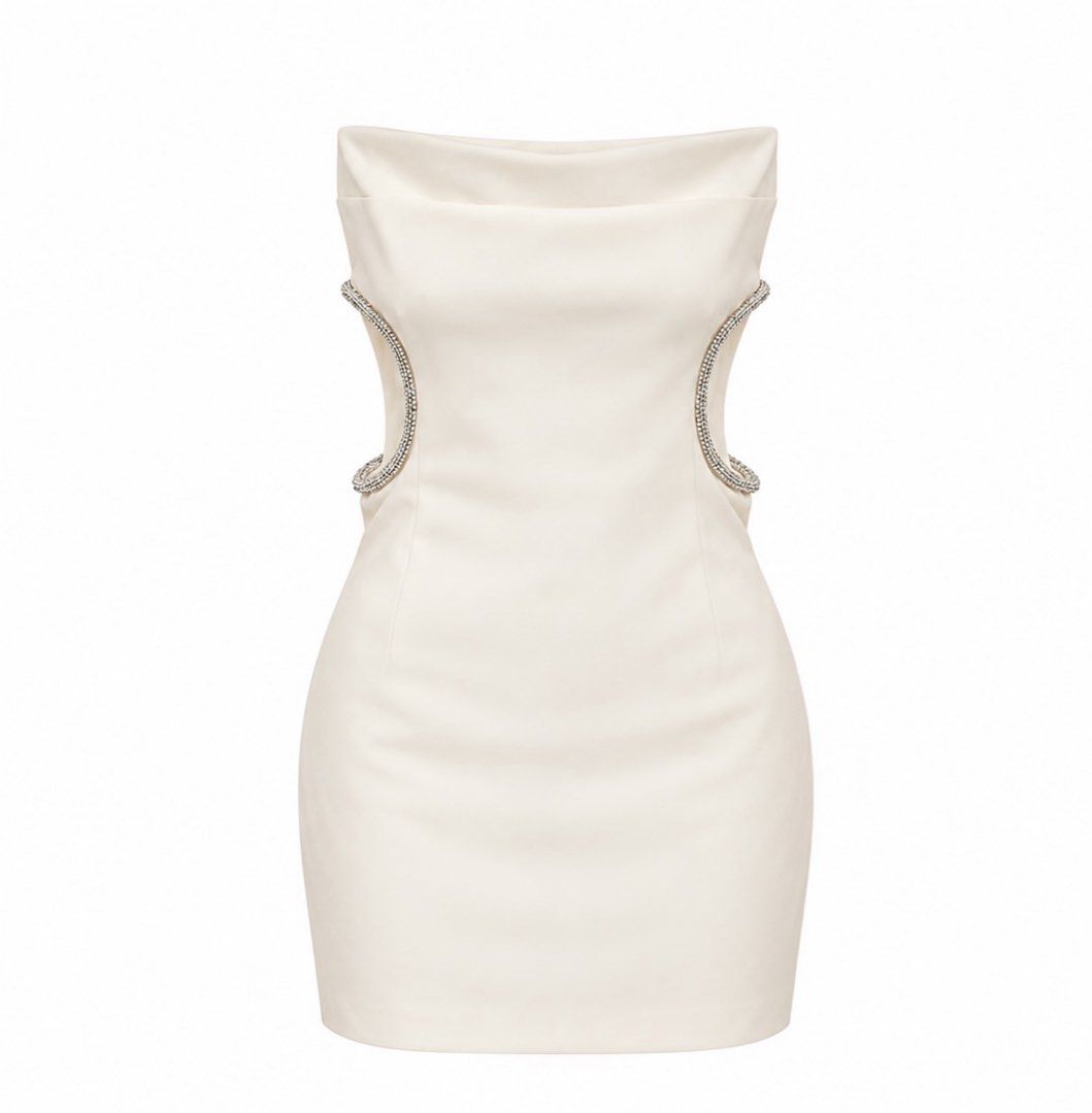 ZARA DRESS (Category: Dresses) located in Manila. Submitted by jess.martinez (Listing ID 1467613138, Image 1). Description: - Style: White strapless bodycon mini dress with eye-catching rhinestone waist cutouts - Design: Straight neckline with chic fold detail, fully lined smooth fabric - Condition: Worn once for a dinner event, dry-cleaned right after, clean inside and out with zero stains or missing stones - Fit: True to size.