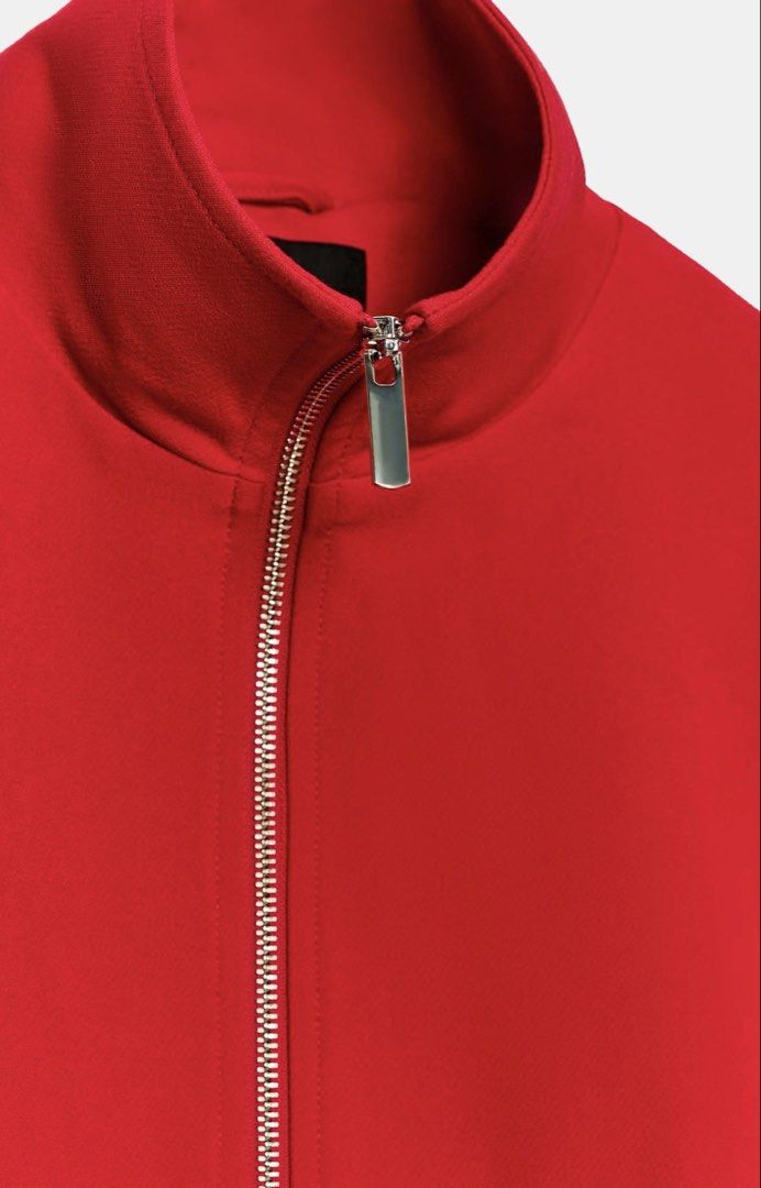 Zara High Collar Bomber Jacket (Category: Coats, Jackets and Outerwear) located in Quezon City. Submitted by justdeclutter2023 (Listing ID 1467716062, Image 3). Description: Bright red zip-up jacket from Zara. High standing collar, silver-tone front zipper with rectangular pull tab. Cropped length with structured seams and gathered hem in back. Long sleeves, relaxed shoulders. Heavy structured fabric. Clean minimal silhouette, vibrant pop of colo