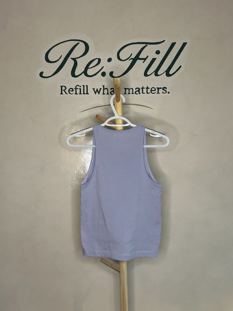 Zara Lilac Ribbed Tank Top Size M (Category: Sleeveless) located in Taguig. Submitted by re.wear.mnl (Listing ID 1467710009, Image 2). Description: - Brand: Zara - Color: Pastel Lilac - Size: Medium - Material: Ribbed knit with great stretch - Design: Classic scoop neckline and sleeveless cut - Versatility: Easy to style with denim, shorts, or skirts; great for warm weather or layering - Condition: Clean and ready to wear.