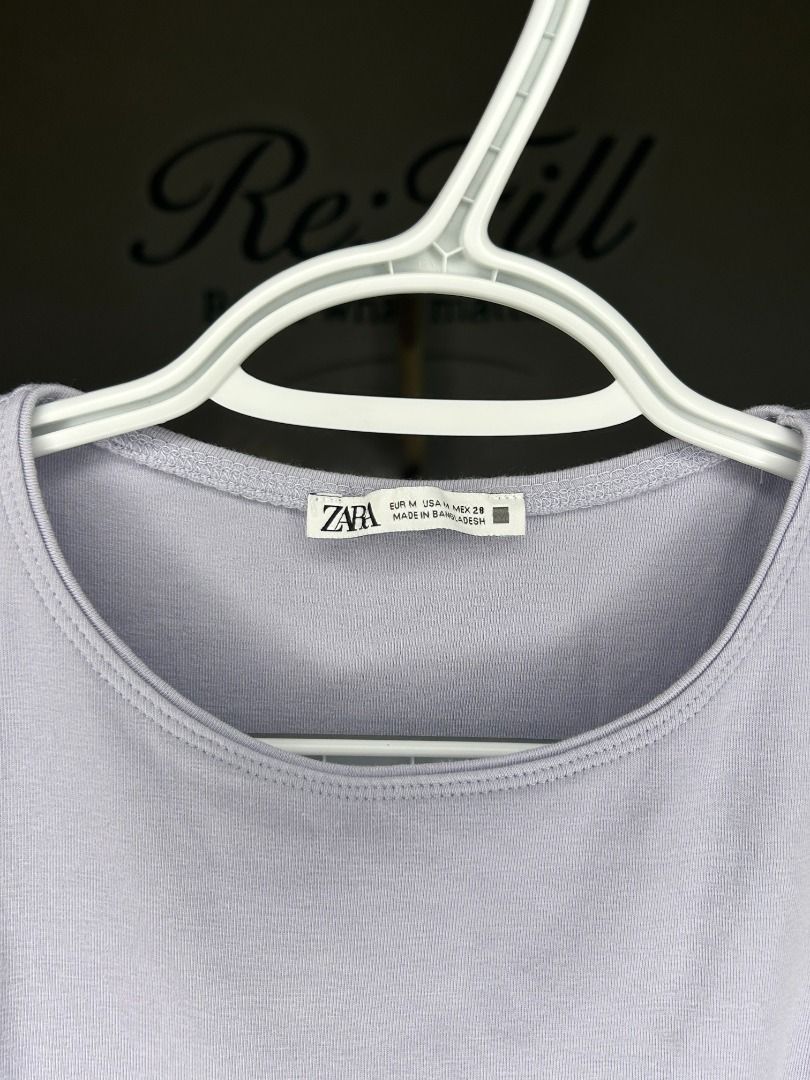 Zara Lilac Ribbed Tank Top Size M (Category: Sleeveless) located in Taguig. Submitted by re.wear.mnl (Listing ID 1467710009, Image 3). Description: - Brand: Zara - Color: Pastel Lilac - Size: Medium - Material: Ribbed knit with great stretch - Design: Classic scoop neckline and sleeveless cut - Versatility: Easy to style with denim, shorts, or skirts; great for warm weather or layering - Condition: Clean and ready to wear.