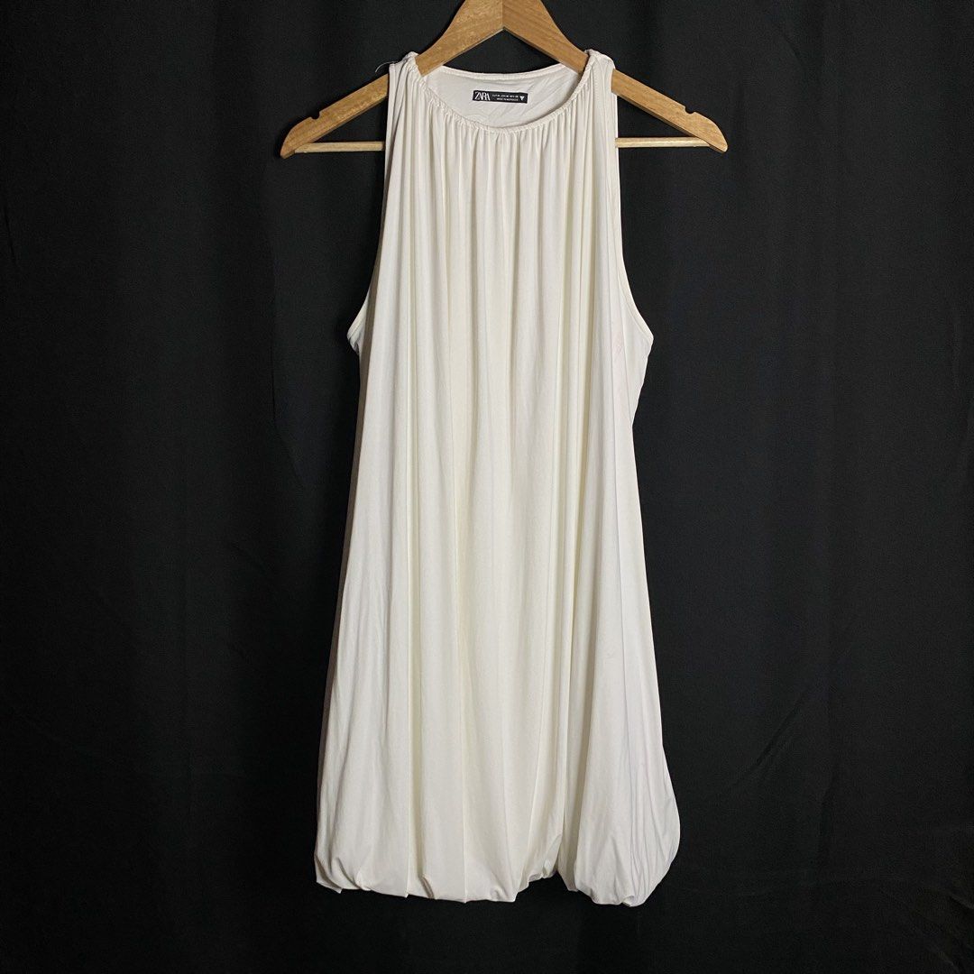 Zara Mini Balloon Dress White (Category: Dresses) located in Manila. Submitted by curatedvg. (Listing ID 1467746371, Image 1). Description: Width: Free Length: 31 inches Waist: 17 inches (unstretched) Size M / Medium Good condition Inside and outside stain (pink, blue) No pinholes.