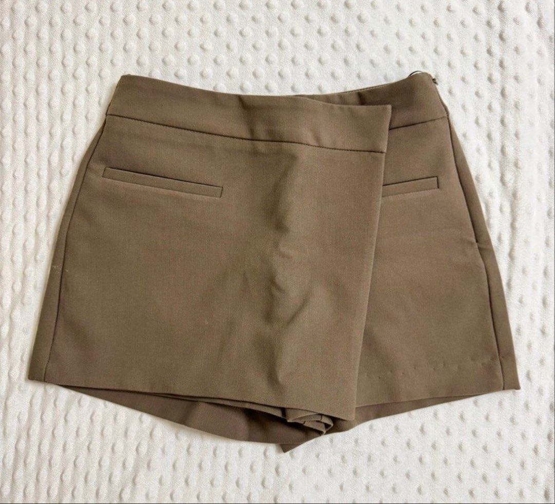 Zara Muted Brown Mini Skort Skirt (Category: Skirts) located in Marikina City. Submitted by cheruboo (Listing ID 1467654588, Image 1). Description: zara mini skort in a muted brown shade! features a skirt-like appearance with the practicality of shorts underneath. easy to style and perfect for everyday wear brand: zara color: muted brown style: mini skort.