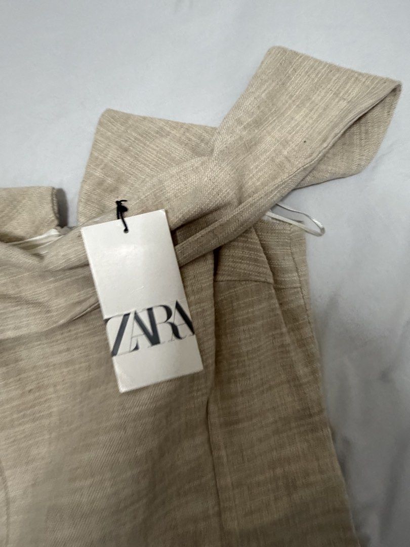 Zara Off-Shoulder Beige Dress (Category: Dresses) located in Santa Rosa. Submitted by decluttering_. (Listing ID 1467610454, Image 2). Description: - Brand: Zara - Style: Off-shoulder dress - Color: Neutral beige (goes with everything) - Size: S - Condition: Brand new with original tags attached, never worn - Details: Textured fabric with a structured body-hugging fit.