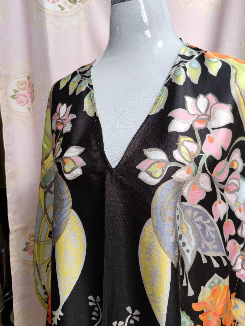 Zara Printed Kaftan Dress (Category: Dresses) located in Manila. Submitted by ashie_clothing (Listing ID 1467652793, Image 3). Description: - Brand: Zara - Style: V-neck kaftan dress with short, loose sleeves - Design: Black base with a colorful floral pattern - Material: Lightweight satin - Size: EUR XS - Origin: Made in Morocco - Condition: Excellent, easy throw-on piece for warm weather or lounging.