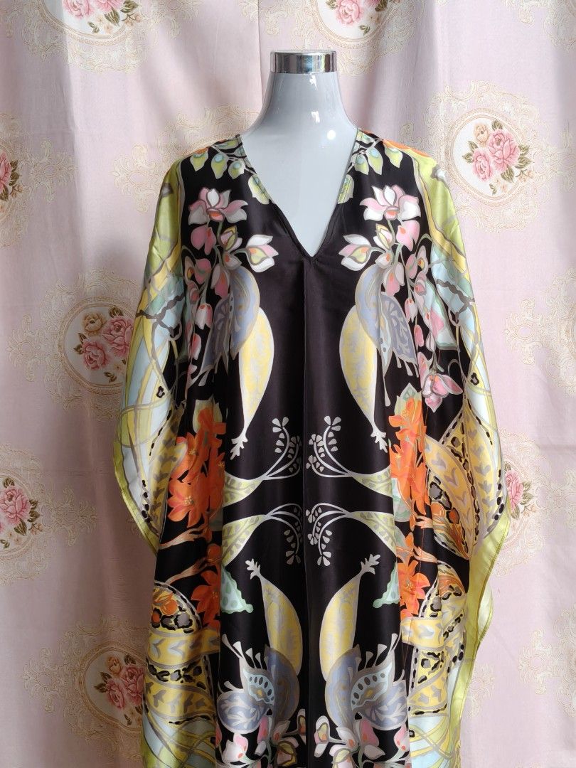 Zara Printed Kaftan Dress (Category: Dresses) located in Manila. Submitted by ashie_clothing (Listing ID 1467652793, Image 1). Description: - Brand: Zara - Style: V-neck kaftan dress with short, loose sleeves - Design: Black base with a colorful floral pattern - Material: Lightweight satin - Size: EUR XS - Origin: Made in Morocco - Condition: Excellent, easy throw-on piece for warm weather or lounging.