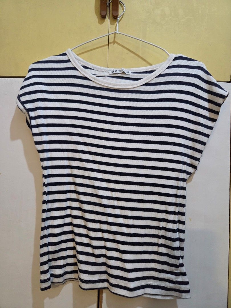 ZARA Striped Cap-Sleeve Top (Size Large) (Category: Blouses) located in Paranaque City. Submitted by mauandchelliedeclutters (Listing ID 1467783581, Image 2). Description: -authentic ZARA Striped Ribbed Top in Size Large - nautical style stripes in off-white and dark navy blue. -​Made from a soft, stretchy ribbed cotton-blend knit fabric. -Designed with a round crew neckline and flattering cap/cap-sleeve cut. ​Key Details & Features: ​Brand: ZARA