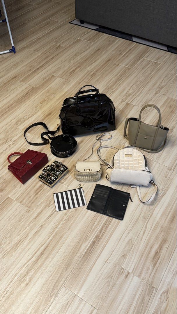 BUNDLE ₱1200 for 9 items Assorted Bags Wallets and Pouches Bundle (Category: Purses & Pouches) located in Makati City. Submitted by declutter_forsale (Listing ID 1467981987, Image 1). Description: - Closet clear-out: Bundle of 9 stylish bags and wallets - Includes: Huge black patent duffel, khaki structured tote, cream quilted backpack, red textured handbag, jeweled evening clutch, round black bag, straw chain bag, black-and-white striped pouch, 
