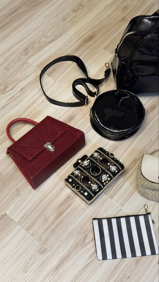BUNDLE ₱1200 for 9 items Assorted Bags Wallets and Pouches Bundle (Category: Purses & Pouches) located in Makati City. Submitted by declutter_forsale (Listing ID 1467981987, Image 2). Description: - Closet clear-out: Bundle of 9 stylish bags and wallets - Includes: Huge black patent duffel, khaki structured tote, cream quilted backpack, red textured handbag, jeweled evening clutch, round black bag, straw chain bag, black-and-white striped pouch, 