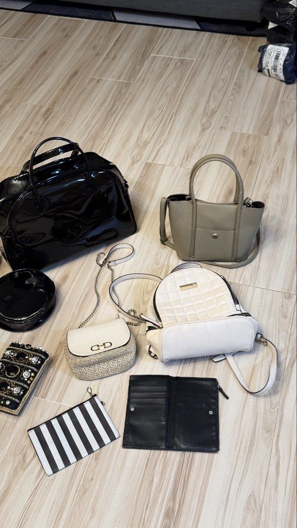 BUNDLE ₱1200 for 9 items Assorted Bags Wallets and Pouches Bundle (Category: Purses & Pouches) located in Makati City. Submitted by declutter_forsale (Listing ID 1467981987, Image 3). Description: - Closet clear-out: Bundle of 9 stylish bags and wallets - Includes: Huge black patent duffel, khaki structured tote, cream quilted backpack, red textured handbag, jeweled evening clutch, round black bag, straw chain bag, black-and-white striped pouch, 