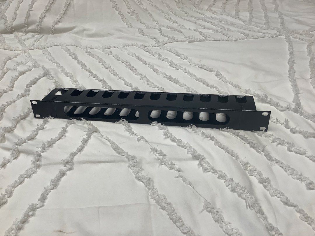 1U Rackmount Horizontal Cable Management Panel Black (Category: Cables & Adaptors) located in Paranaque City. Submitted by seb_trading (Listing ID 1467860529, Image 1). Description: - Standard 19-inch rackmount size with 1U height - Durable black metal construction with a clean, scratch-free finish - Numerous finger slots on top for easy routing - Front and back pass-through holes for seamless cable management - Keeps your server rack neat, tidy,