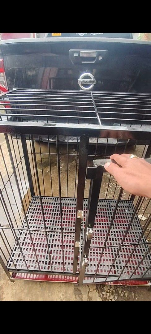 2*3*3 dog cage (Category: Storage Boxes & Baskets) located in Cavite. Submitted by krifordviado (Listing ID 1468022327, Image 3). Description: - Heavy-duty 2*3*3 dog cage - round bar grills with secure front double latch lock - Removable plastic grid flooring for comfort - Slide-out red tray underneath for hassle-free cleanup - Ideal and safe enclosure for dogs and other pets.