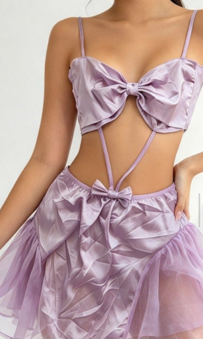💜 Lavender Satin Bow Cut-Out Terno Set (Category: Undergarments & Loungewear) located in Kalibo. Submitted by cloth.ly (Listing ID 1467856423, Image 3). Description: Measurements: • Bust: = 30" • Waist: 24" — stretchy fit • Hips: = 44" • Skirt Length: 12" • Adjustable spaghetti straps Details: • Sweetheart neckline with big bow detail 🎀 • Unique cut-out design — dainty & feminine ☁️ • Silky satin fabric + tulle overlay on skirt • Matching bow a