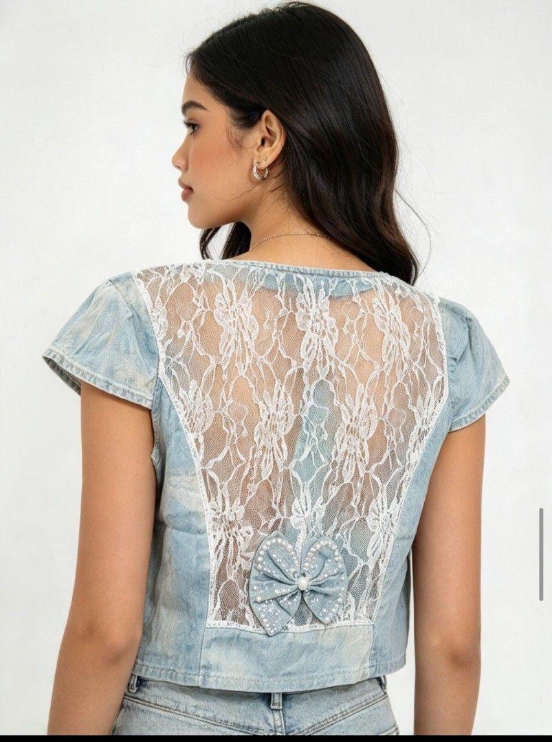 🦋 Y2K Denim & Lace Bow Vest ✨ (Category: Blouses) located in Kalibo. Submitted by cloth.ly (Listing ID 1467851846, Image 3). Description: Measurements: • Pit to Pit: 30" • Length: 15" • Shoulder Width: 13" Details: • Light-wash denim with sheer floral lace sides & back • Beautiful pearl & sequin butterfly appliqué at front 🦋 • Lace back with denim bow detail — so pretty from behind! • Short cap sleeves • Open front style • True Y2K vintage vibe