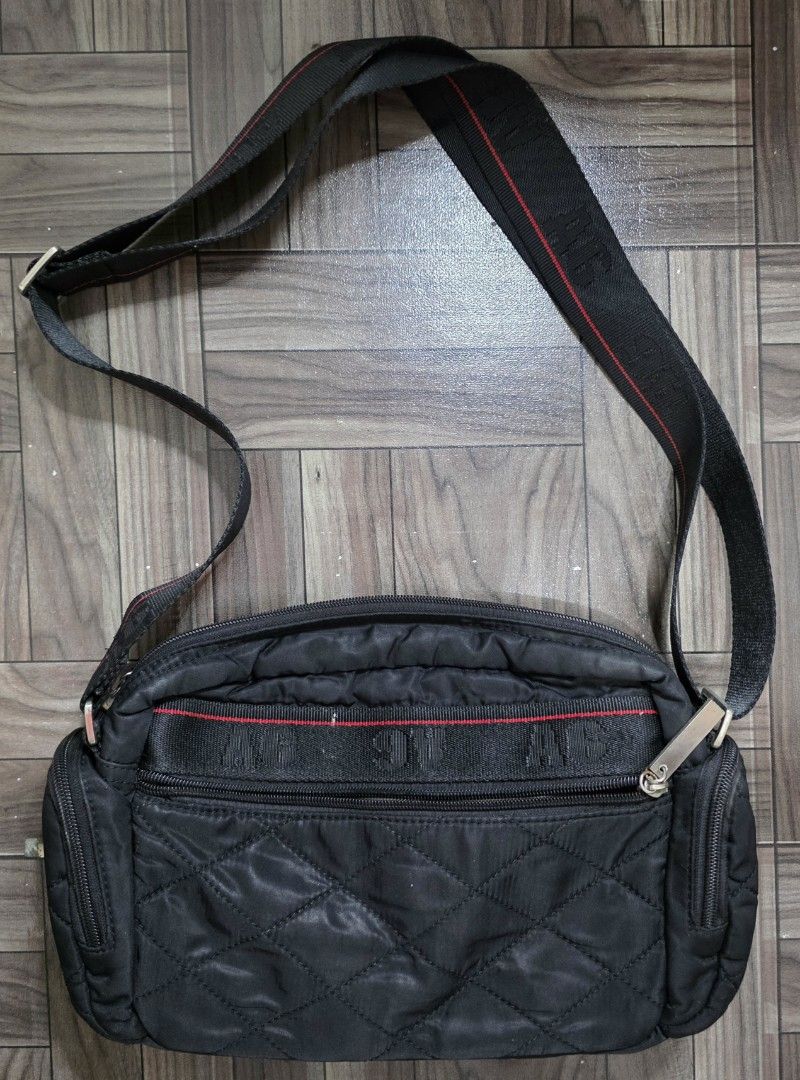 A6 Nylon Quilted Crossbody Bag (Category: Cross-body Bags) located in Quezon City. Submitted by thriftstershop (Listing ID 1467997173, Image 2). Description: Brand: A6 Condition: Excellent Meet up: Trinoma or LRT 2 Anonas Shipping: LBC - Weekdays J&T - Weekends.