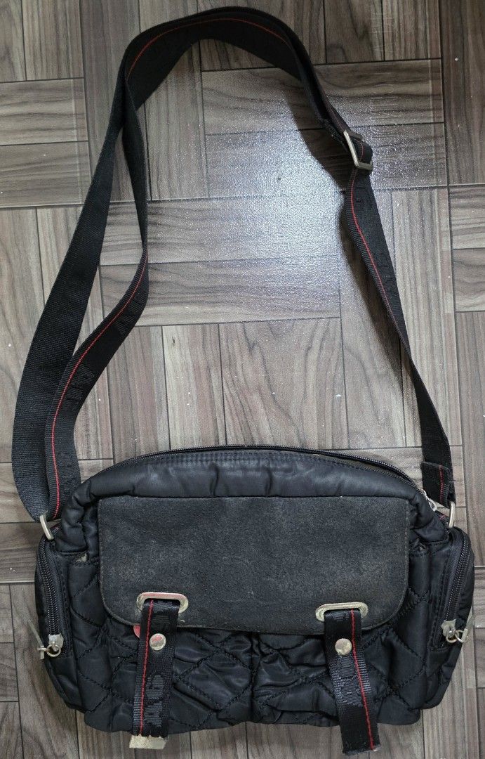 A6 Nylon Quilted Crossbody Bag (Category: Cross-body Bags) located in Quezon City. Submitted by thriftstershop (Listing ID 1467997173, Image 1). Description: Brand: A6 Condition: Excellent Meet up: Trinoma or LRT 2 Anonas Shipping: LBC - Weekdays J&T - Weekends.