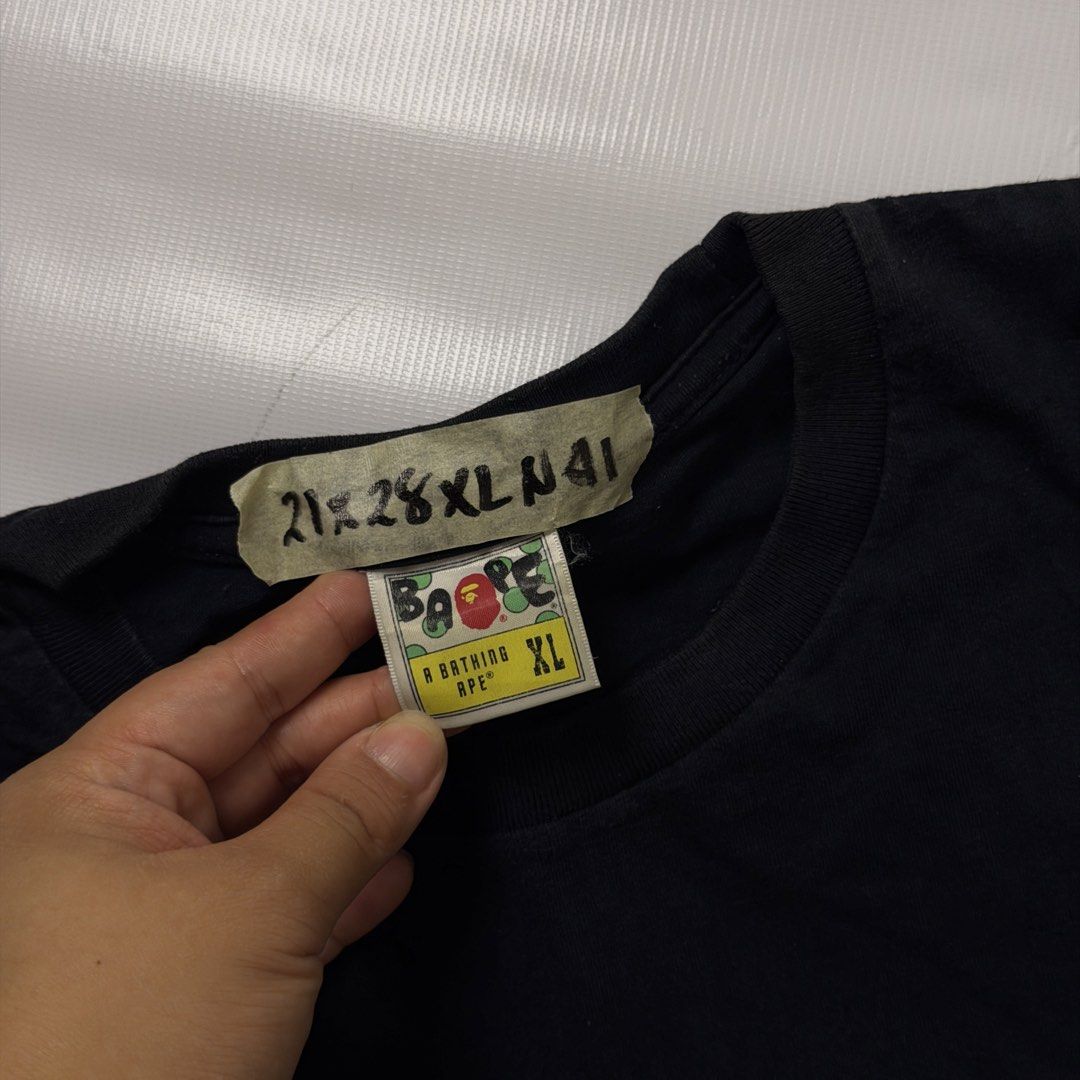 A Bathing Ape World Gone Mad Tee Black XL (Category: Tshirts & Polo Shirts ) located in Gapan. Submitted by rasthriftshop17 (Listing ID 1468007280, Image 3). Description: BAPE w/back hit Size on tag: XL Dimes: 21 x 28 ₱950 + sf Condition: Excellent Color rate: 9/10 Issue: None.