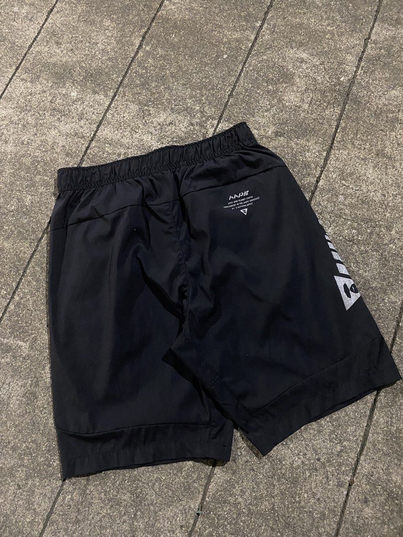 AAPE By A Bathing Ape Black Shorts (Category: Shorts) located in Manila. Submitted by jedgarments0 (Listing ID 1468004725, Image 2). Description: - Brand: AAPE by A Bathing Ape - Color: Black - Fit: Elastic waistband with adjustable drawstring - Design: Large reflective AAPE logo on the right leg, with subtle branding on the left thigh and back - Storage: 2 secure zippered side pockets - Material: Lightweight and breathable fabric - Style: Essent