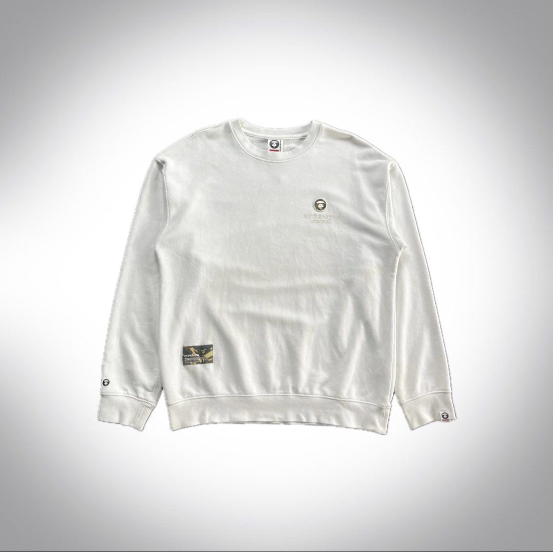 AAPE NOW White Sweatshirt Size M (Category: Coats, Jackets and Outerwear) located in Manila. Submitted by thrifted4life (Listing ID 1467983618, Image 1). Description: AAPE BY *A BATHING APE® crewneck Size M - W:21.5 L:26 Excellent Condition 9.5/10 Light stain .