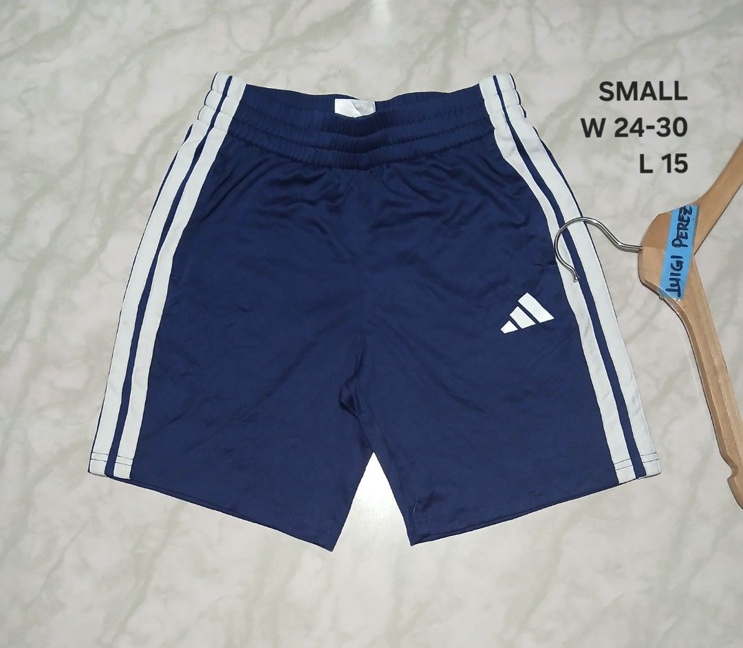 Adidas Blue White 3-Stripes Athletic Shorts (Category: Shorts) located in Plaridel. Submitted by igieperez147282 (Listing ID 1467987089, Image 1). Description: - Brand: Adidas - Color: Blue with classic white 3-stripes and logo - Size: Small (Waist: 24-30 inches, Length: 15 inches) - Features: Adjustable elastic waistband for a comfortable fit - Origin: Made in Vietnam - Condition: Inner tags intact with style codes.