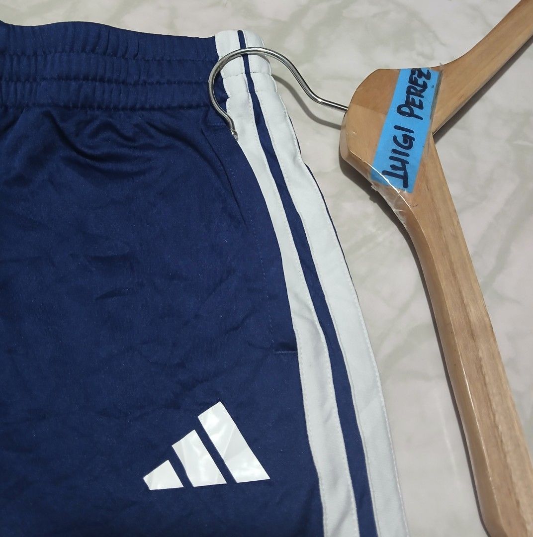 Adidas Blue White 3-Stripes Athletic Shorts (Category: Shorts) located in Plaridel. Submitted by igieperez147282 (Listing ID 1467987089, Image 3). Description: - Brand: Adidas - Color: Blue with classic white 3-stripes and logo - Size: Small (Waist: 24-30 inches, Length: 15 inches) - Features: Adjustable elastic waistband for a comfortable fit - Origin: Made in Vietnam - Condition: Inner tags intact with style codes.