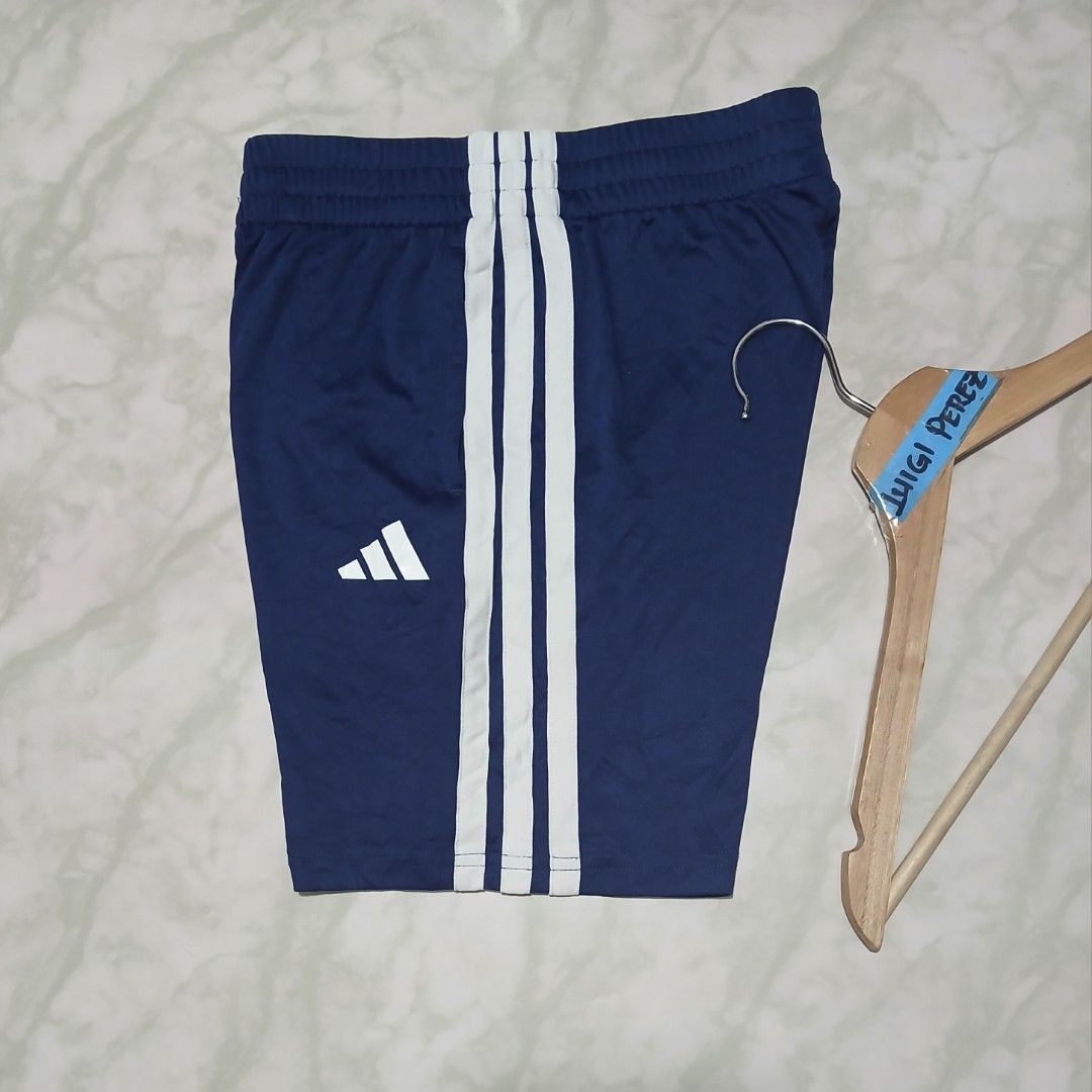 Adidas Blue White 3-Stripes Athletic Shorts (Category: Shorts) located in Plaridel. Submitted by igieperez147282 (Listing ID 1467987089, Image 2). Description: - Brand: Adidas - Color: Blue with classic white 3-stripes and logo - Size: Small (Waist: 24-30 inches, Length: 15 inches) - Features: Adjustable elastic waistband for a comfortable fit - Origin: Made in Vietnam - Condition: Inner tags intact with style codes.
