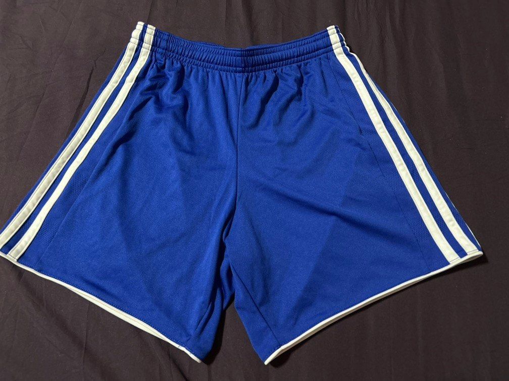 Adidas ClimaCool Royal Blue Athletic Shorts (Category: Shorts) located in Pasig City. Submitted by mixpicks (Listing ID 1459445940, Image 2). Description: - Royal blue Adidas shorts - Features ClimaCool technology for breathability - Elastic waistband with adjustable drawstring - Classic white stripe detail on the sides - Ideal for sports activities or everyday casual wear -13” long - Made in Cambodia - 28-32 waist line - logo at the back .