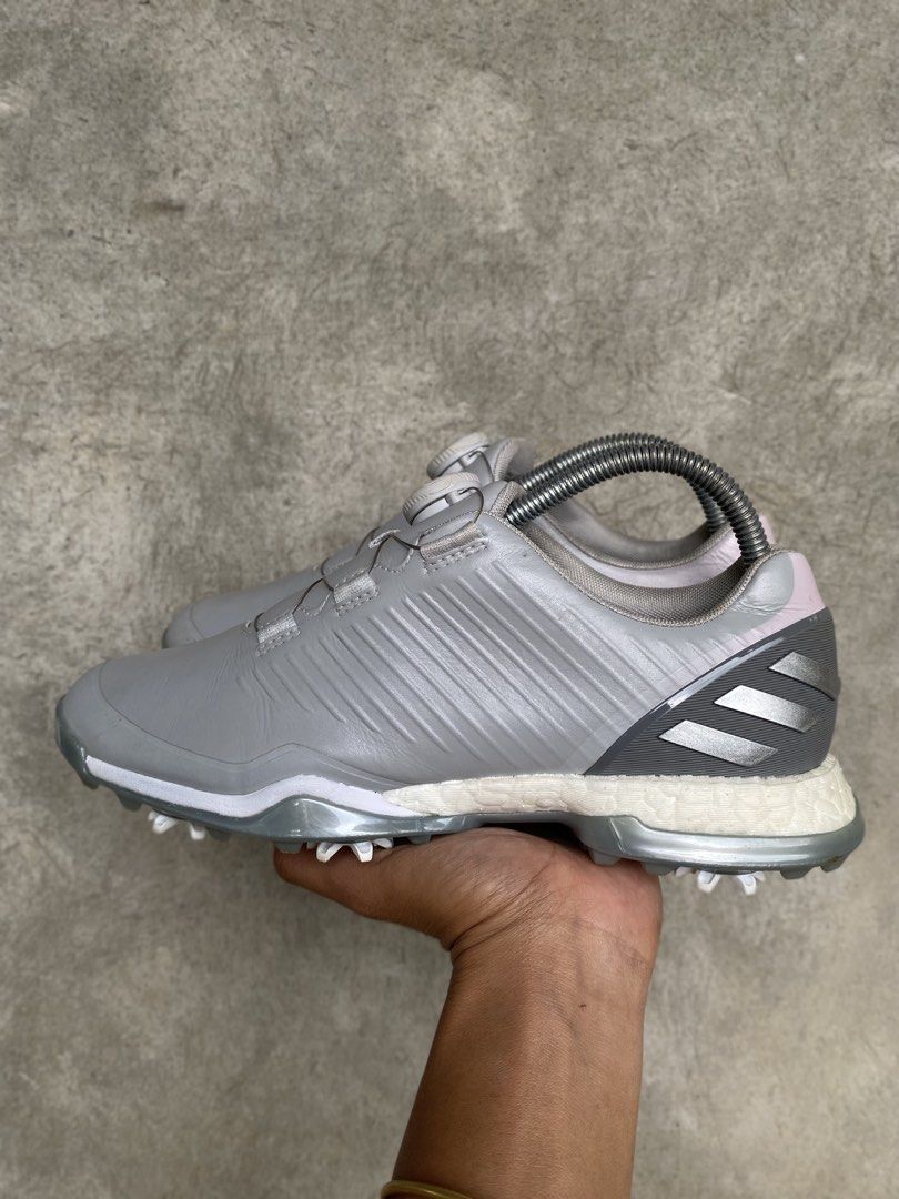 Adidas Golf Shoes with BOA Lacing System (Category: Golf) located in Manila. Submitted by clevermountain_9c1516 (Listing ID 1467910310, Image 2). Description: - Brand: Adidas - Color: Grey with subtle silver accents - Closure: BOA lacing dial system for quick, easy adjustments - Midsole: Responsive Boost foam for all-day comfort - Outsole: Spiked for superior grip and stability on the course - Condition: Minor dirt on soles from previous rounds o