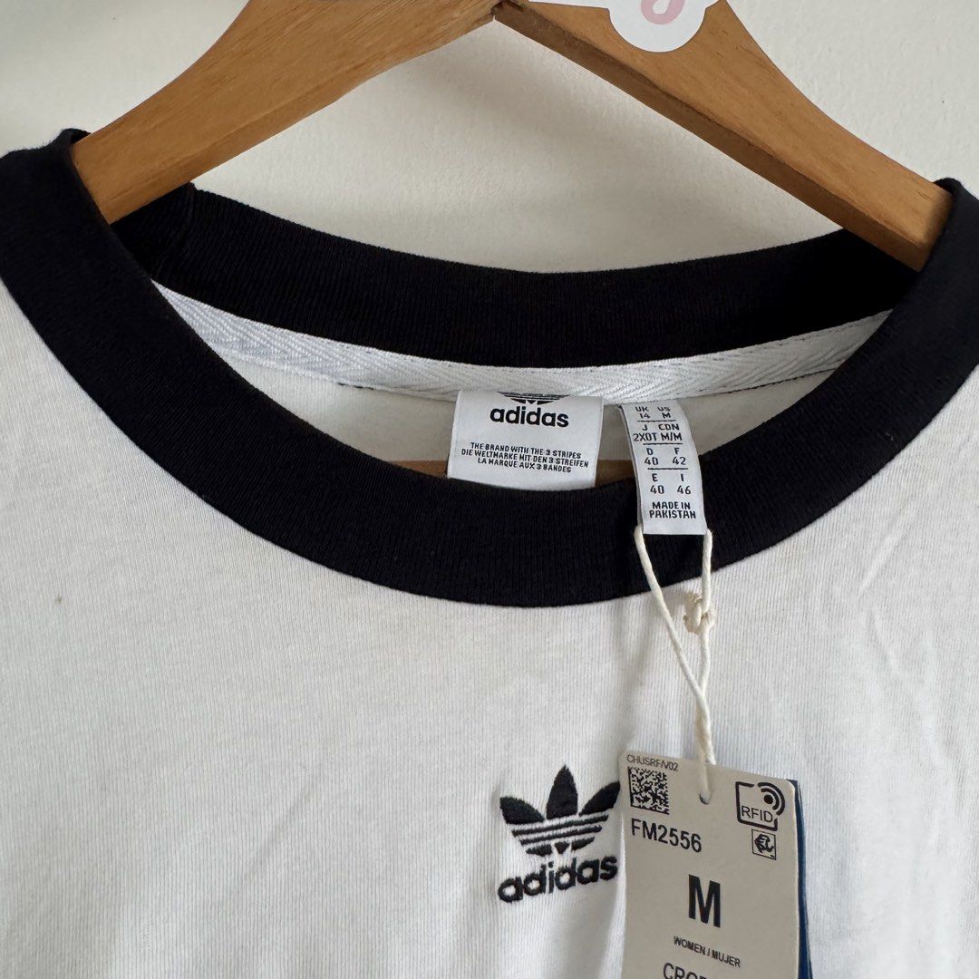 Adidas shirt (Category: Blouses) located in Manila. Submitted by apparella.ph (Listing ID 1467839939, Image 3). Description: Selling low Got it pa sa u.s for $30 + tax Na stock lng sa cabinet. Doesn’t fit me anymore has minimal stain,removable(kayo nlng po maglaba. Check last pic ) Bust.38 Length:19 ☑️Everything is my Own preloved / BNWT/BNWOT ☑️ not thrifted/Ukay ☑️ malukot sa picture kasi na stock sa cabinet (tinatamad mag plantsa ✌️ ) ☑️Person