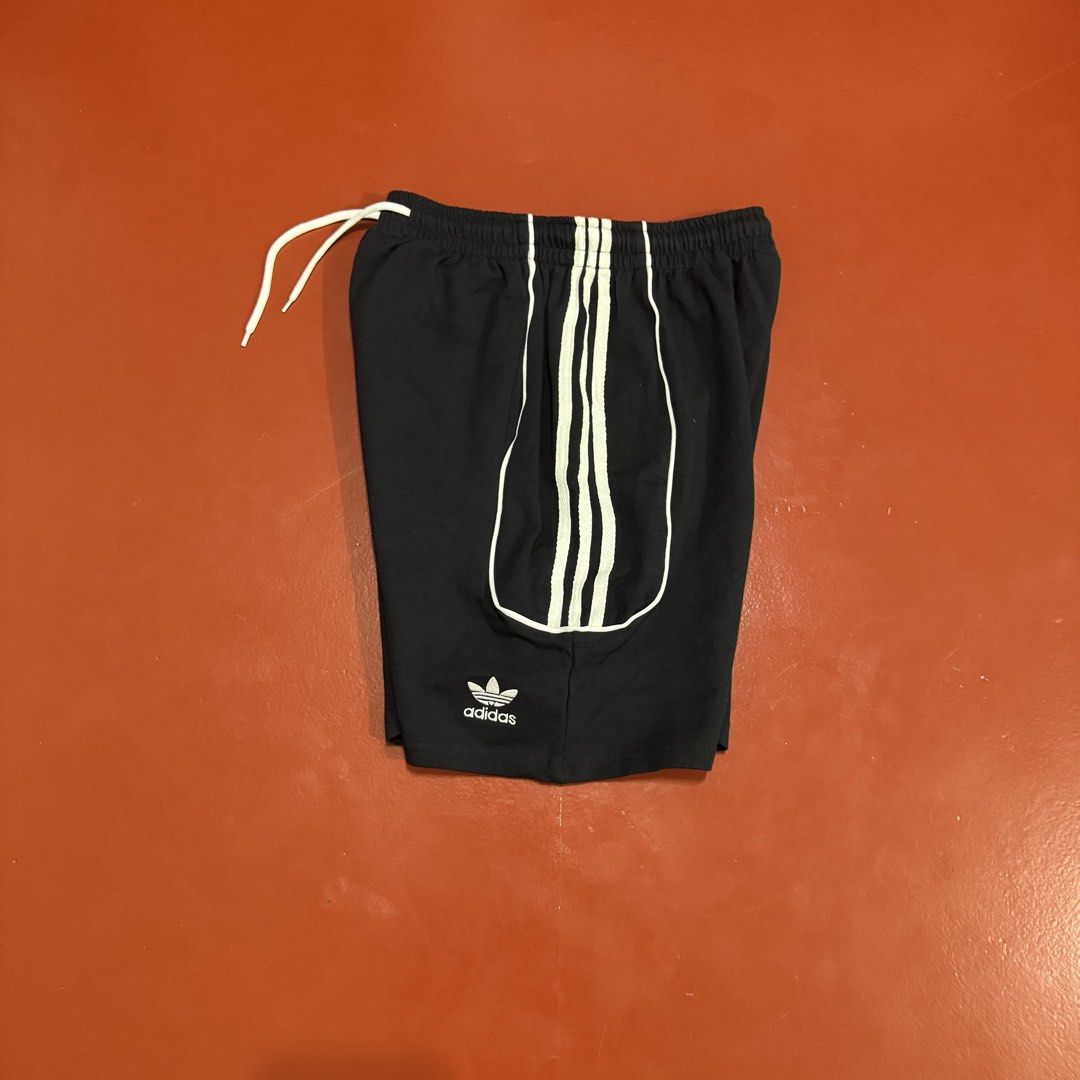 ADIDAS SHORTS (Category: Shorts) located in Pasig City. Submitted by buzzthrifty (Listing ID 1468008340, Image 3). Description: SIZE 26-32(34MAX) WAIST 17"LENGTH 11" HEM GOOD AS NEW .