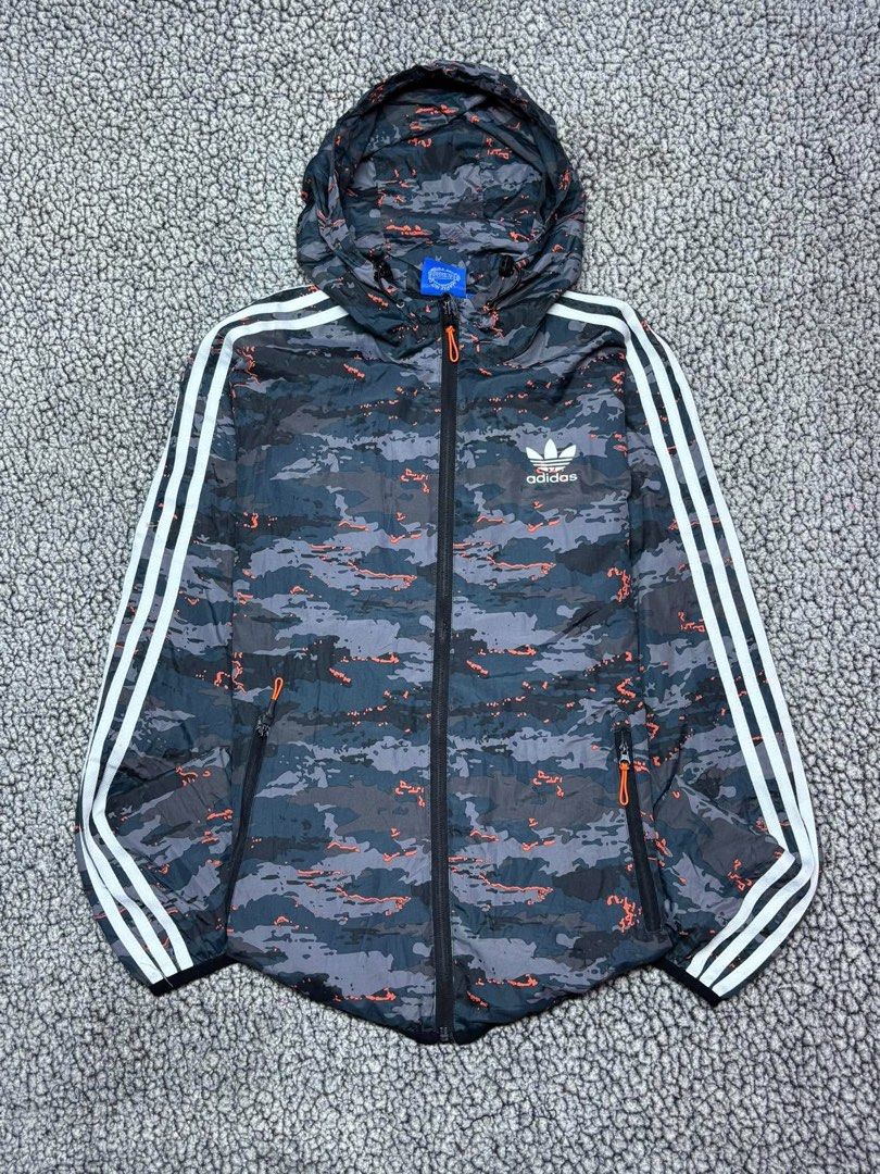 Adidas Three Stripes Camouflage Windbreaker (Category: Hoodies) located in Tayabas. Submitted by retro.rags69 (Listing ID 1467846923, Image 1). Description: • Excellent condition • Color rate: 9.5/10 • width: 21 • length: 26 • No Issue • Printed Logo Design • Camouflage Colorway • Best Fit: Medium.