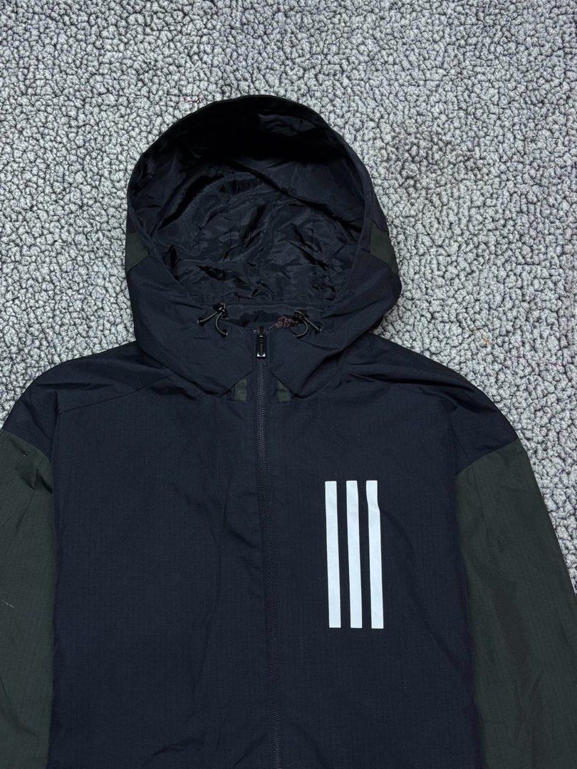 Adidas Three Stripes Heavyweight Windbreaker (Category: Hoodies) located in Tayabas. Submitted by retro.rags69 (Listing ID 1467846832, Image 2). Description: • Excellent condition • Color rate: 9.5/10 • width: 23 • length: 27 • No Issue • Printed Logo Design • Two-tone Colorway • Best Fit: Large.