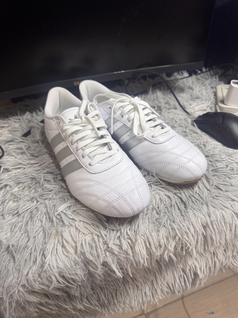 Adidas White and Silver Sneakers (Category: Sneakers) located in Manila. Submitted by keendog_e47ca3 (Listing ID 1467914304, Image 3). Description: - Style: Classic low-top sneakers with quilted toe stitching - Colorway: White leather with metallic silver stripes and heel tab - Sole: Durable gum rubber outsole - Inclusions: Comes with white laces - Best for: Comfortable daily wear.