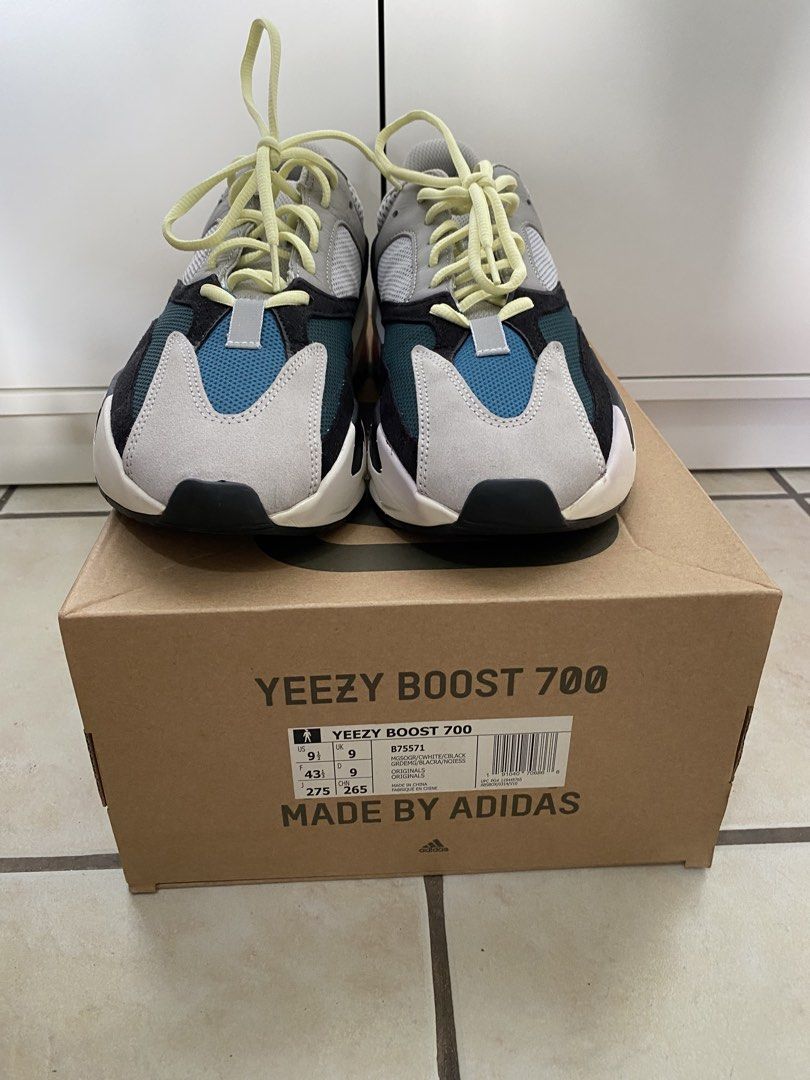 Adidas Yeezy Boost 700 Wave Runner (Category: Sneakers) located in Makati City. Submitted by dripfitsmanila (Listing ID 1467911020, Image 3). Description: - Brand: Adidas Yeezy Boost 700 - Colorway: Wave Runner (Multi-color) - Size: US 9.5 - Condition: Clean, minimal wear visible - Inclusions: Original box and light yellow laces - Details: Grey mesh/leather, black suede overlays, teal toe box, orange midsole accents.