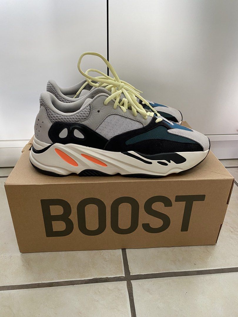 Adidas Yeezy Boost 700 Wave Runner (Category: Sneakers) located in Makati City. Submitted by dripfitsmanila (Listing ID 1467911020, Image 2). Description: - Brand: Adidas Yeezy Boost 700 - Colorway: Wave Runner (Multi-color) - Size: US 9.5 - Condition: Clean, minimal wear visible - Inclusions: Original box and light yellow laces - Details: Grey mesh/leather, black suede overlays, teal toe box, orange midsole accents.