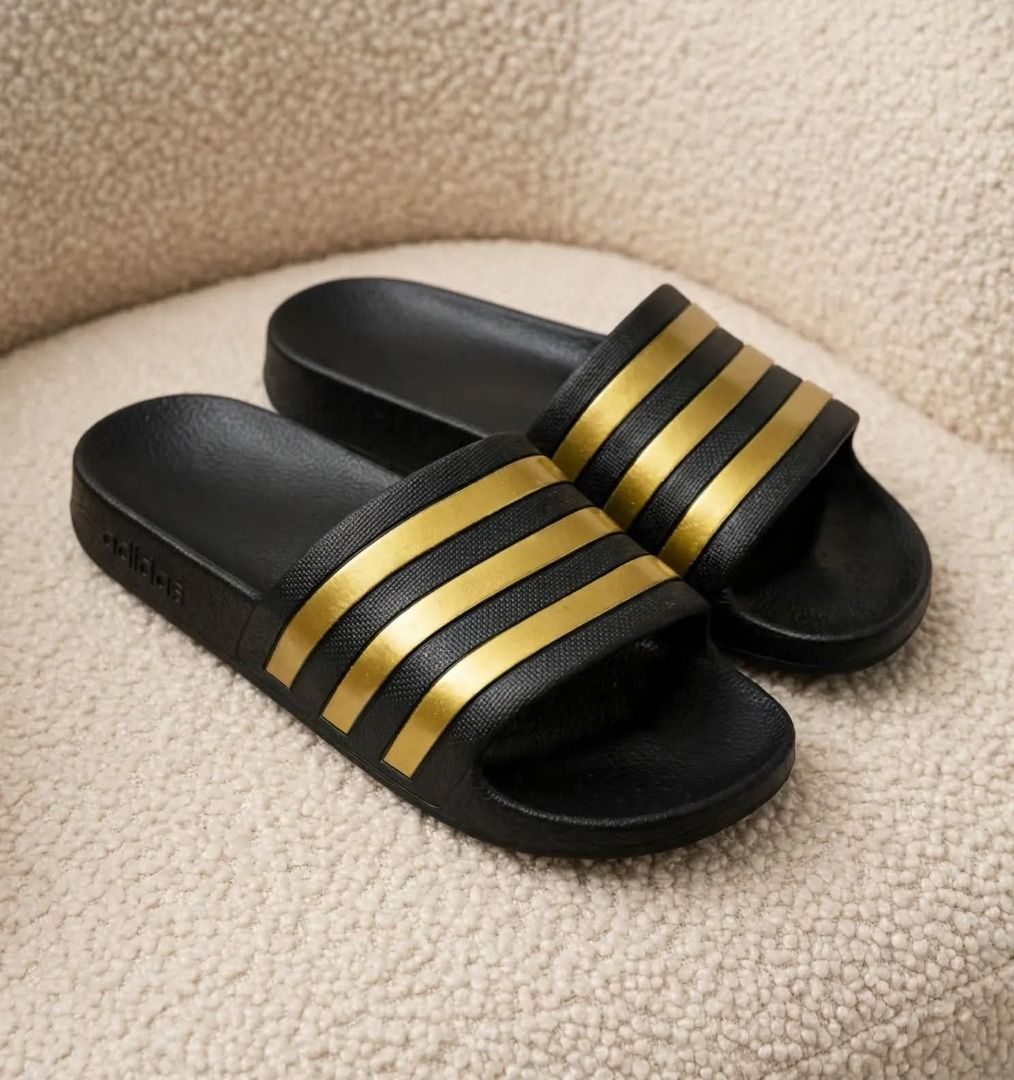Adillette Aqua Black/Gold Metallic (Category: Slippers and slides) located in Rizal. Submitted by hiraya16 (Listing ID 1467978283, Image 1). Description: Onhand ready to ship Womens 7/8/9 DM us for inquiries. ✉️.