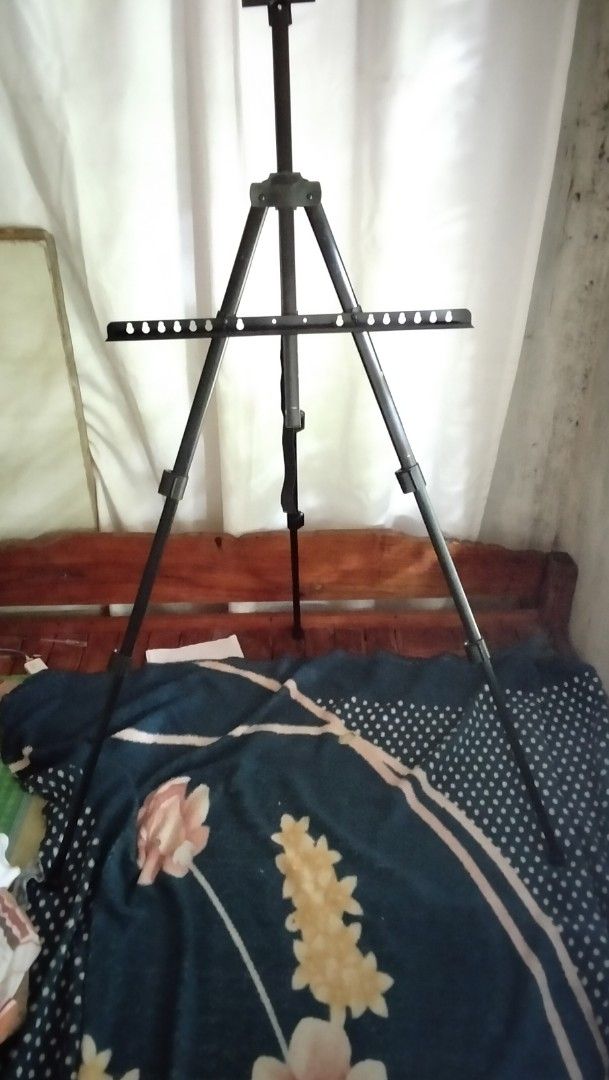 Adjustable Portable Metal Artist Easel Stand (Category: Art & Prints) located in Manila. Submitted by epicocean_bc6ede (Listing ID 1467862466, Image 2). Description: - Versatile black metal easel for painting and sketching - Adjustable telescoping legs from 50cm to 160cm total height - Secure tray holds canvases firmly in place - Lightweight and compact design folds down easily - Includes a black carrying bag with a shoulder strap for effortless 