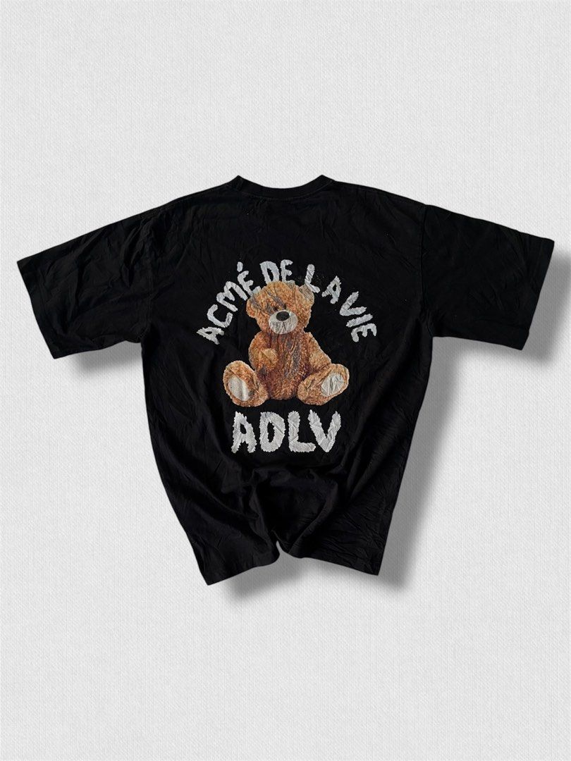 ADLV Bear Print Black T-Shirt (Category: Shirts) located in Cebu City. Submitted by northdrip.threadd (Listing ID 1467903394, Image 3). Description: - Brand: ADLV (Acme De La Vie) - Color: Classic Black - Fit: Relaxed, oversized fit with crew neckline - Design: Small front teddy bear graphic and large back teddy bear print with lettering.