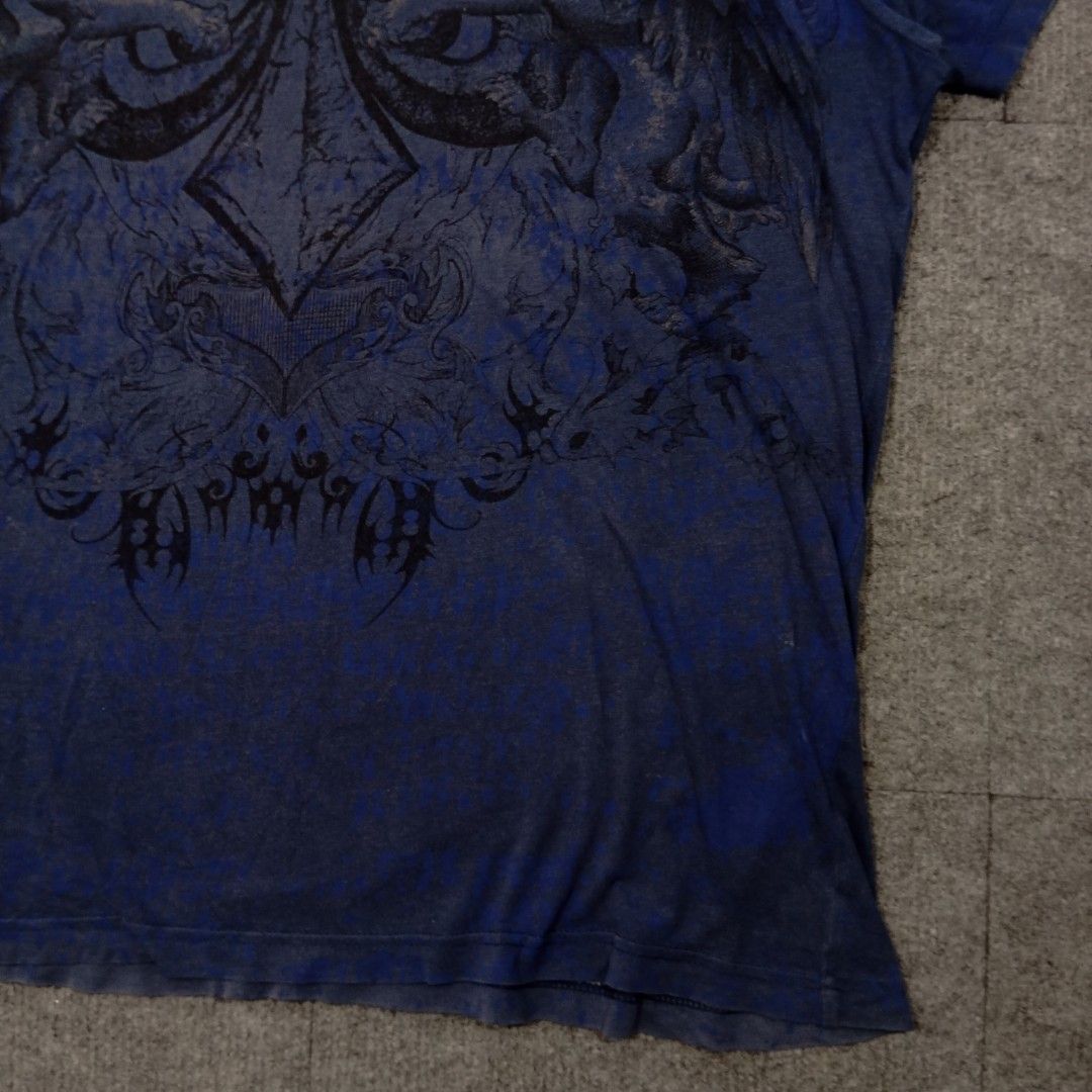Affliction Simultaneous Tshirt (Category: Activewear) located in Taguig. Submitted by sito. (Listing ID 1467884551, Image 3). Description: For sale! 📣 Affliction Simultaneous Tshirt Specs and measurements: • Size XL • Length 29 inches • Width 23 inches Condition Details: • Sign of use • Discoloration • Color rate: 8/10 • Overall Condition: 7/10 what a collectible piece! Price: ~ ₱765 Transaction Details: Location: Upper Bicutan, Taguig City, Met