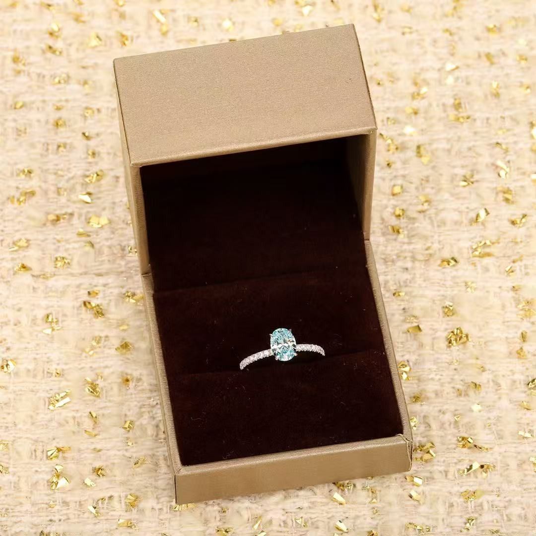 AG925 Light Blue Oval CZ Ring (Category: Rings) located in Mandaluyong City. Submitted by sadihaviur09733 (Listing ID 1467919722, Image 1). Description: - Stunning oval light blue center stone with a dazzling pave band - Crafted in high-quality AG925 silver with a clear hallmark stamp - Total diamond equivalent weight of 1.74ct engraved inside the shank - Sleek silver-tone setting for an elegant everyday look - Includes a classy brown velvet ring
