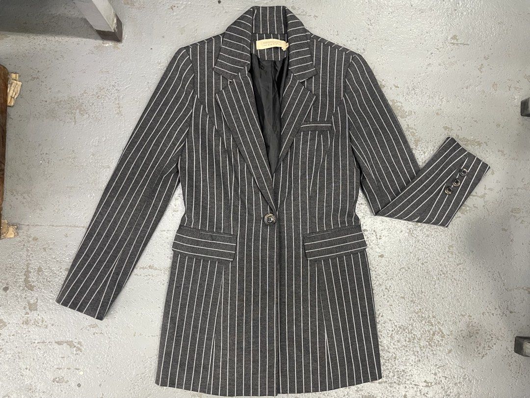 Aierfeiyang Grey Pinstripe Long Blazer (Category: Coats, Jackets and Outerwear) located in Bulacan. Submitted by grazcloset (Listing ID 1467890269, Image 1). Description: - Grey longline blazer with white pinstripes - Single front button closure & decorative sleeve buttons - Structured lapel collar and functional flap pockets - Fully lined with smooth black fabric - Versatile for workwear and smart casual looks.