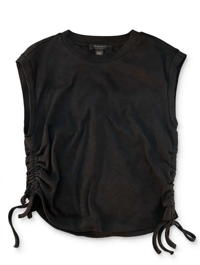 AllSaints Black Sleeveless Top with Side Ruched Drawstrings (Category: Sleeveless) located in Cainta. Submitted by mariss.luxx (Listing ID 1467899173, Image 1). Description: - Brand: AllSaints - Color: Black - Style: Sleeveless top with crew neck - Details: Adjustable ruched drawstrings on both sides with hanging ties, small brand logo on back collar - Origin: Made in Turkey - Condition: Excellent, clean fabric with no stains or damage.