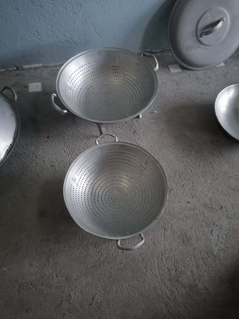 Aluminium Woks Colanders Lids Utensils Scale (Category: Cookware & Accessories) located in Makati City. Submitted by cathymadrid18 (Listing ID 1467956768, Image 1). Description: - Complete kitchen gear bundle ideal for starting out or upgrading your setup - Includes multiple aluminium woks, colanders with handles, and matching lids - Comes with two wooden-handled cooking utensils for daily use - Features a vintage-style red mechanical weighing sc