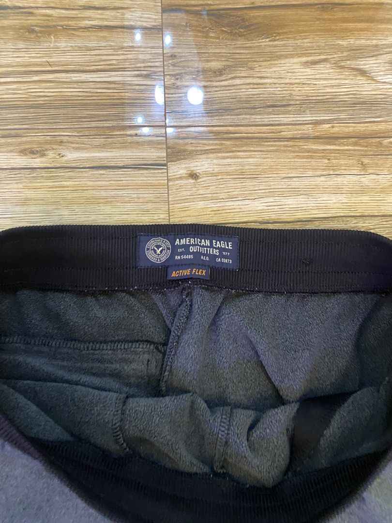 American Eagle Outfitters Active Flex Joggers Grey (Category: Joggers) located in Baguio. Submitted by dreshop (Listing ID 1467847203, Image 2). Description: - Brand: American Eagle Outfitters - Color: Dark Grey - Material: Super comfortable Active Flex - Features: Black elastic waistband, adjustable drawstrings, and ribbed ankle cuffs - Measurements: Waist 34" | Length 39" | Thigh 20" | Crotch 14" - Condition: Great casual staple piece, perfect 